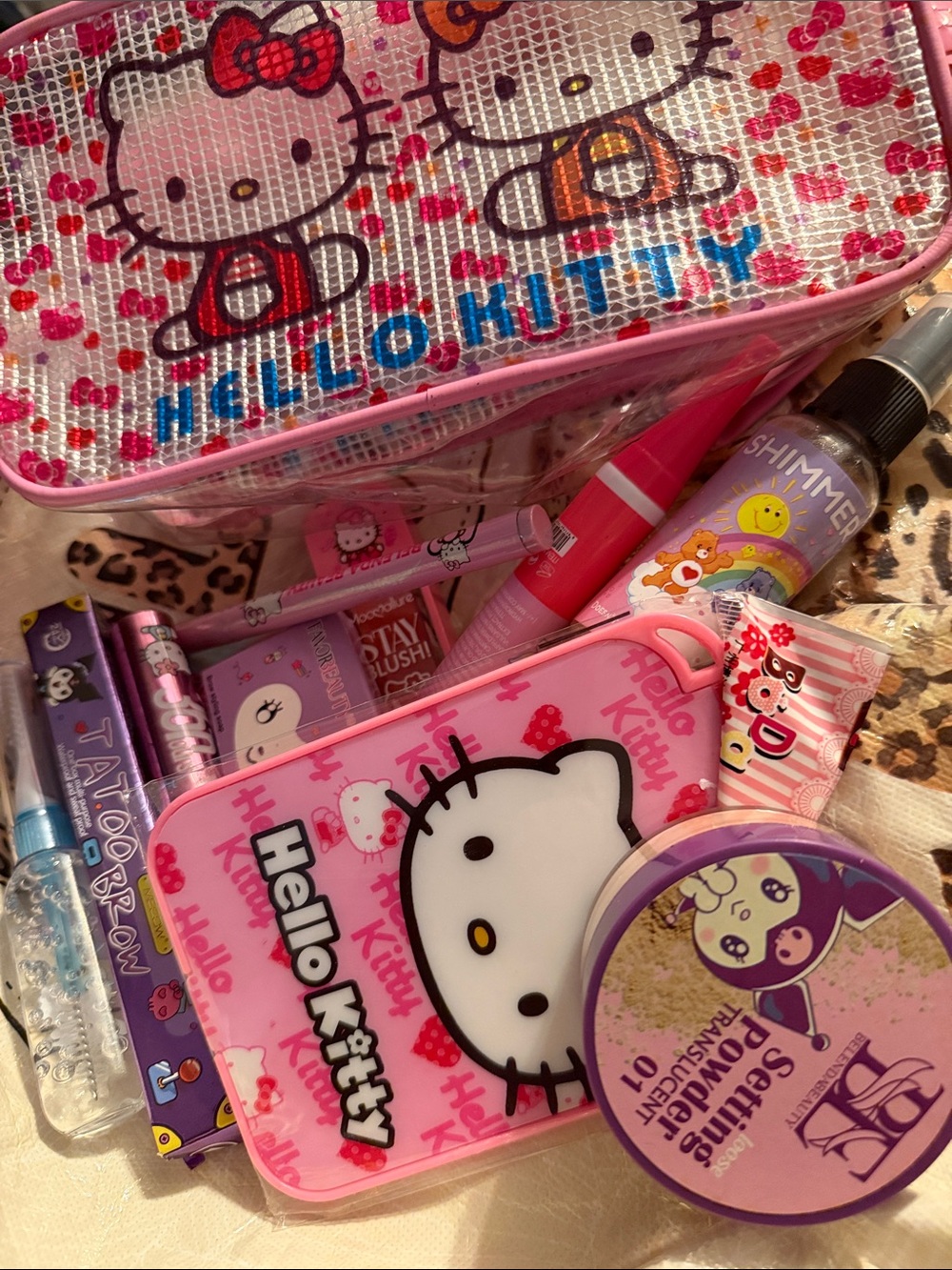 Hello Kitty Pink and Purple Cosmetic Kit with Bow Graphic filled with makeup